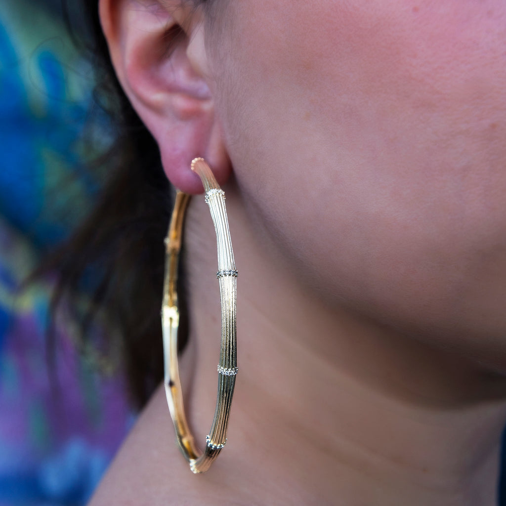 GLD Women Iced Textured Bamboo Hoop Earrings in Yellow Gold