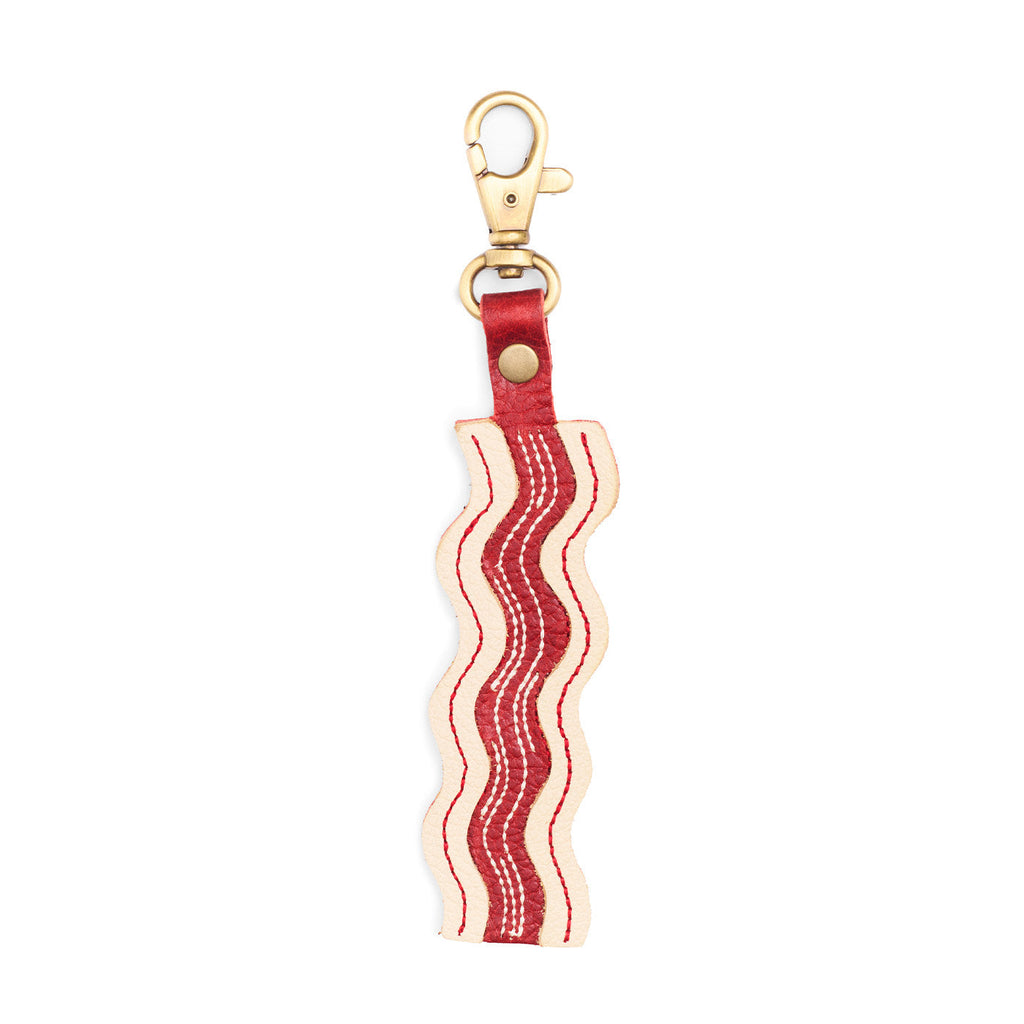 Pancetta | Keychain shaped like a strip of bacon with a swivel lobster clasp on a white background